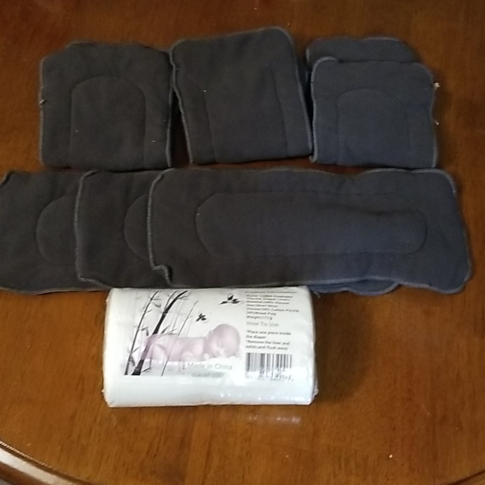 6 charcoal cloth diaper inserts and 100 liners